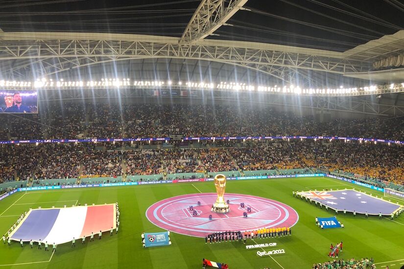 The French and Aussie teams line up ahead of kick-off in the Al Janoub Stadium