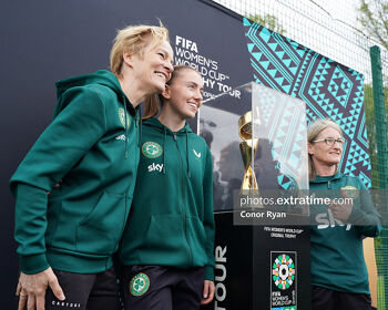 Vera Pauw, Abbie Larkin and Olivia O'Toole with the Women's World Cup trophy