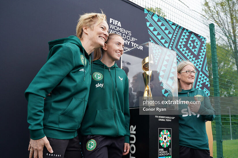 Vera Pauw, Abbie Larkin and Olivia O'Toole with the Women's World Cup trophy