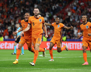 Stefan de Vrij of the Netherlands celebrates scoring his team's first goal with teammate Xavi Simons during the UEFA EURO 2024 quarter-final match between Netherlands and Turkey in Berlin's Olympiastadion