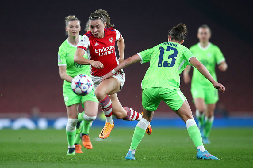 LONDON, ENGLAND - MARCH 23: Katie McCabe of Arsenal breaks past Felicitas Rauch of VfL Wolfsburg during the UEFA Women's Champions League Quarter Final First Leg match between Arsenal WFC and VfL Wolfsburg at Emirates Stadium on March 23, 2022 in London