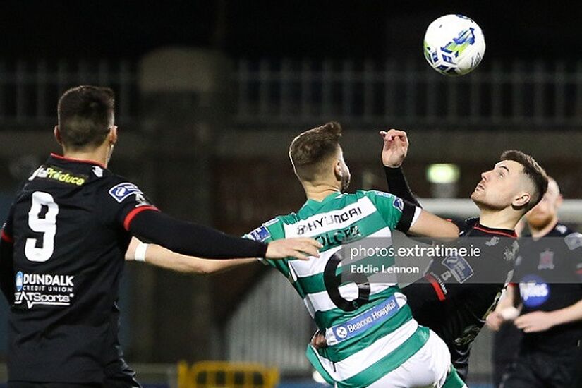 Flores in action for Dundalk against Shamrock Rovers in February.