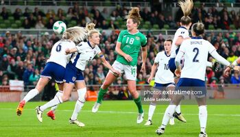 Kyra Carusa challenging for the ball with England skipper Leah Williamson in Ireland's EURO 2025 clash with England