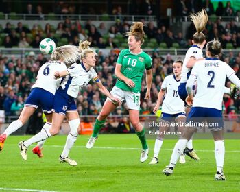 Kyra Carusa challenging for the ball with England skipper Leah Williamson in Ireland's EURO 2025 clash with England