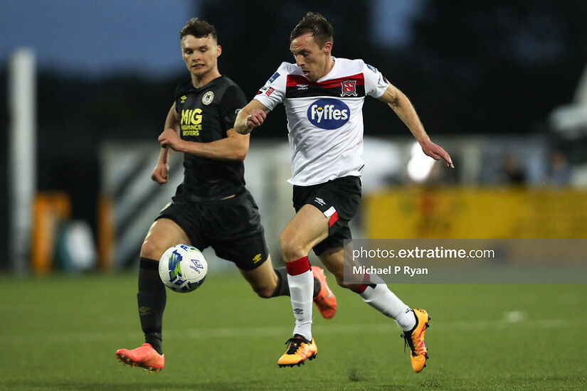 Luke McNally of St Patrick's Athletic vies for the ball with Dundalk's David McMillan during their SSE Airtricity League Premier Division fixture at Oriel Park on July 31st, 2020.