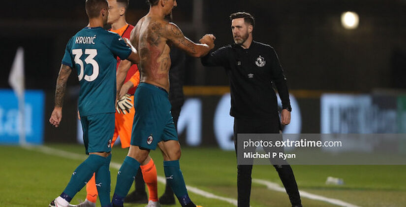 Stephen Bradley with Zlatan Ibrahimovic of AC Milan during Rovers' European game against AC Milan in 2020