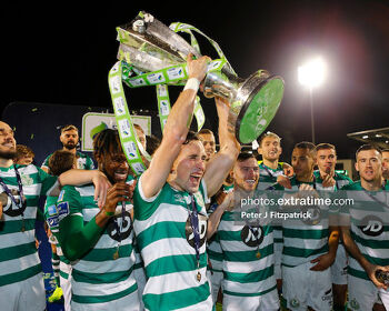 Aaron McEneff lifting the league trophy