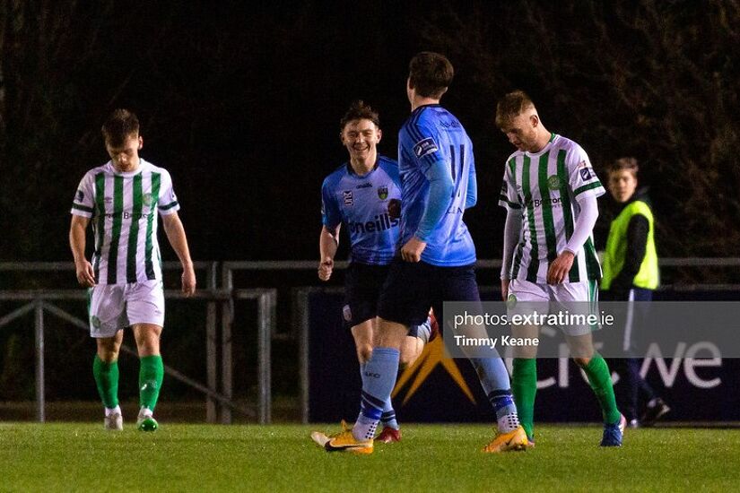 UCD players celebrate a goal while Bray players would have to wait until the second half to really get into the game.