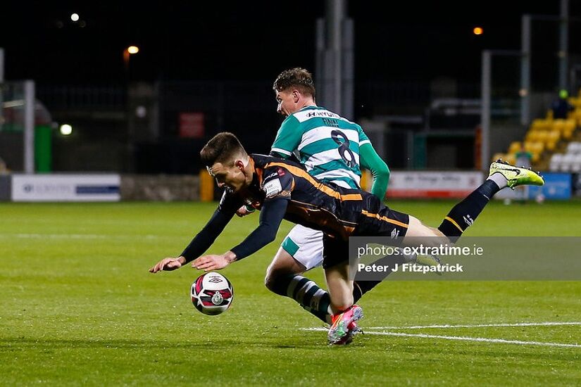 Darragh Leahy of Dundalk FC and Ronan Finn of Shamrock Rovers challenge for the ball during the President's Cup Final.
