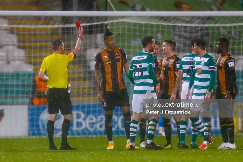 Referee Damien MacGraith shows the red card to Dundalk player Sonni Nattestad.