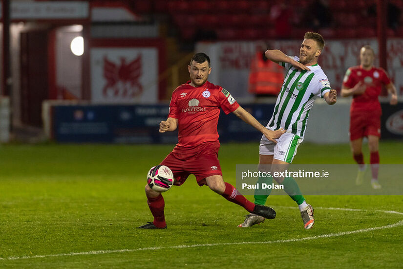 Ryan Brennan of Shelbourne FC holds off Conor Clifford of Bray Wanderers