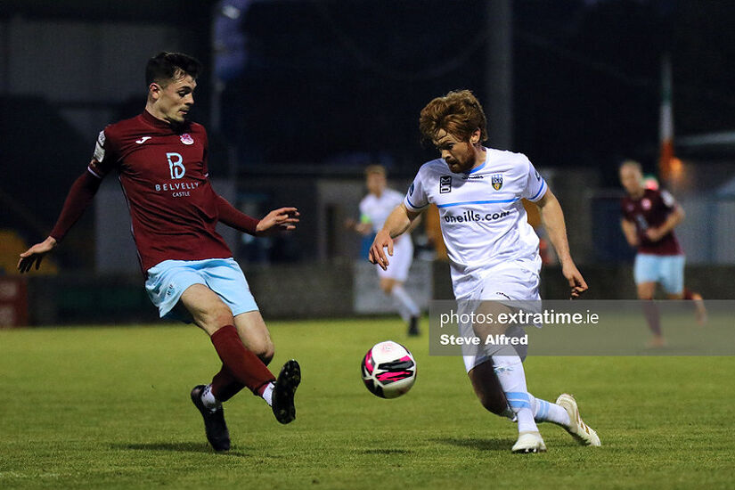 Pierce Phillips of Cobh Ramblers tackles Paul Doyle of UCD during the Students' 4-0 win at St Colman's Park on April 3rd, 2021.