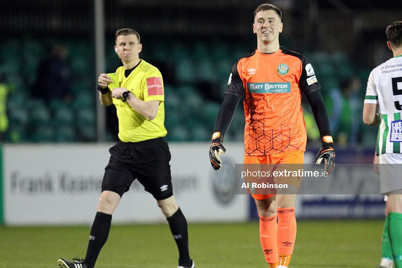 Brian Maher smiles as he recieves a yellow card.