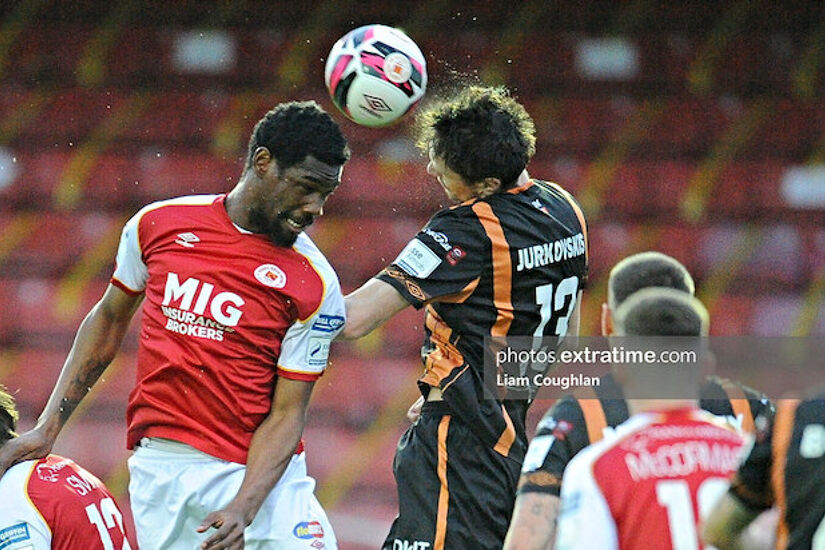 Nahum Melvin-Lambert and Raivis Jurkovskis compete for the ball in May's match in Richmond Park