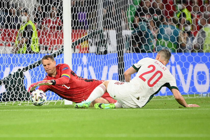 Roland Sallai of Hungary stretches for the ball whilst under pressure from Manuel Neuer of Germany during the UEFA Euro 2020 Championship Group F match between Germany and Hungary at Allianz Arena on June 23, 2021 in Munich, Germany. 