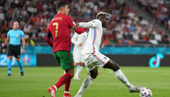 Paul Pogba holds off Cristiano Ronaldo during the 2-2 draw in Budapest