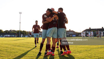 Conor Drinan of Cobh Ramblers and teammates celebrates after scoring the side's first goal.