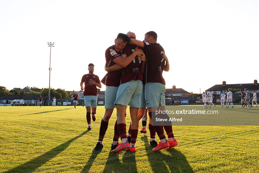Conor Drinan of Cobh Ramblers and teammates celebrates after scoring the side's first goal.