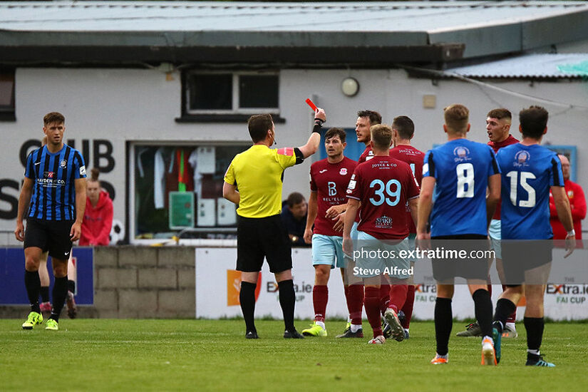 Ben O’Riordan of Cobh Ramblers is shown a red card by referee Eoghan O’Shea.
