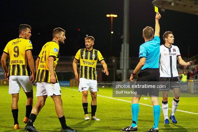Raivis Jurkovskis is shown a yellow card.