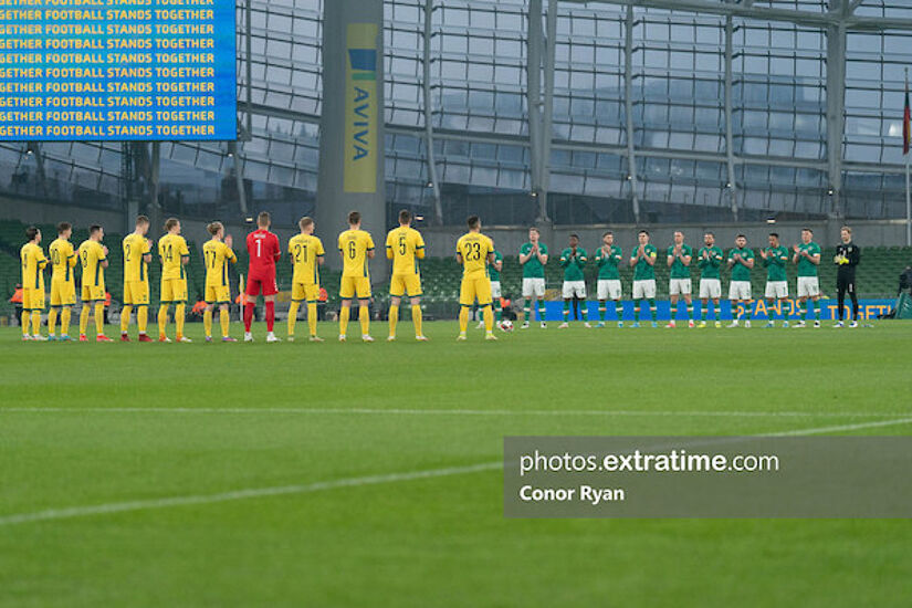 Lithuanian and Irish players applaud in support of the people of the Ukraine