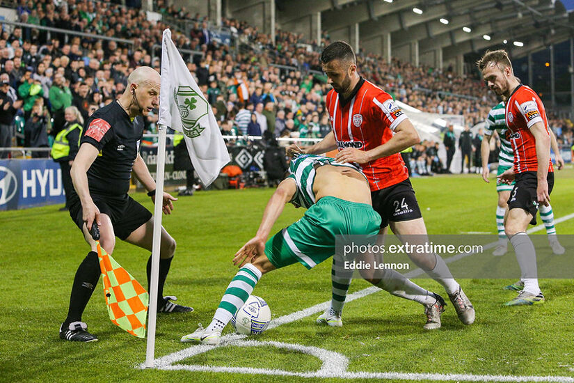 Graham Burke runs the ball into the corner flag in injury time with Danny Lafferty in close attendance in Rovers' 1-0 win over Derry City