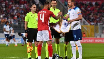 Harry Kane and Steve Borg shake hands prior to the UEFA EURO 2024 qualifying round group C match between Malta and England at Ta' Qali Stadium in Valletta