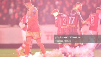 Bohemian FC goalkeeper Kacper Chorazka watches as Flares interrupt the SSE Airtricity Men's Premier Division match between Bohemian FC and St. Patrick's Athletic FC at Richmond Park, Dublin on Feb. 23, 2024