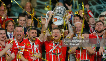 Patrick McEleney (c) of Derry City raises the FAI Cup after the 2022 final