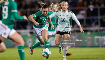 Katie McCabe of Ireland in action against Charlie Estcourt of Cymru in the friendly between the sides in Tallaght February 2024