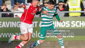 Trevor Clarke of Shamrock Rovers challenges for the ball with Joe Redmond of St Patrick's Athletic