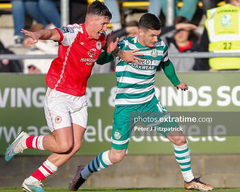 Trevor Clarke of Shamrock Rovers challenges for the ball with Joe Redmond of St Patrick's Athletic