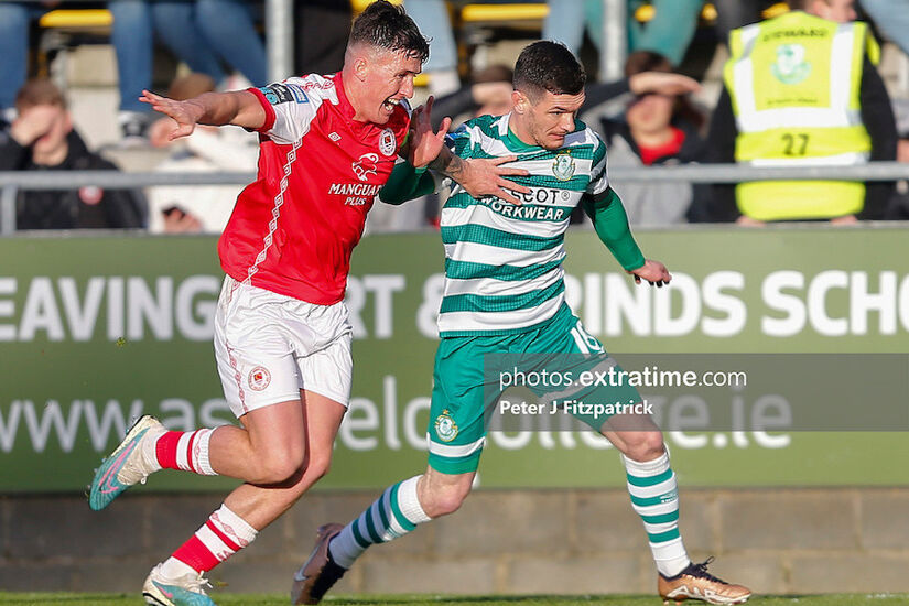 Trevor Clarke of Shamrock Rovers challenges for the ball with Joe Redmond of St Patrick's Athletic
