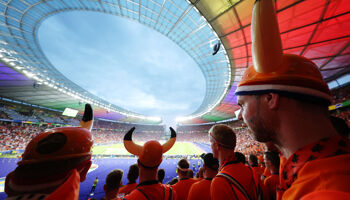 A general view of the inside of the stadium as fans of the Netherlands, wearing hats with horns on, watch the match during the UEFA EURO 2024 quarter-final match between Netherlands and T?rkiye at Olympiastadion on July 06, 2024 in Berlin, Germany.