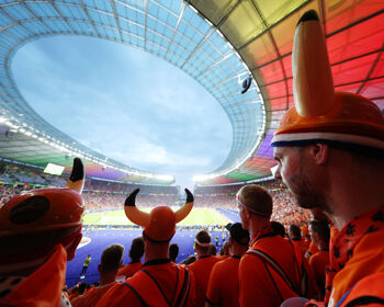 A general view of the inside of the stadium as fans of the Netherlands, wearing hats with horns on, watch the match during the UEFA EURO 2024 quarter-final match between Netherlands and T?rkiye at Olympiastadion on July 06, 2024 in Berlin, Germany.