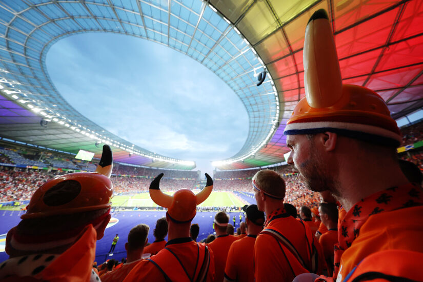 A general view of the inside of the stadium as fans of the Netherlands, wearing hats with horns on, watch the match during the UEFA EURO 2024 quarter-final match between Netherlands and T?rkiye at Olympiastadion on July 06, 2024 in Berlin, Germany.