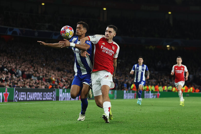 Jakub Kiwior of Arsenal challenges for the ball with Goncalo Borges of FC Porto during the UEFA Champions League 2023/24 round of 16 second leg match between Arsenal FC and FC Porto at Emirates Stadium