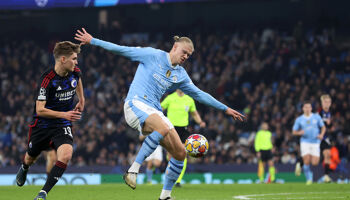 Erling Haaland of Manchester City controls the ball whilst under pressure from Elias Jelert of FC Copenhagen during their UEFA Champions League 2023/24 round of 16 second leg match at Etihad Stadium