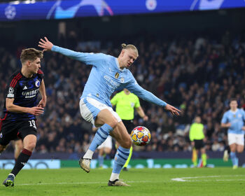 Erling Haaland of Manchester City controls the ball whilst under pressure from Elias Jelert of FC Copenhagen during their UEFA Champions League 2023/24 round of 16 second leg match at Etihad Stadium