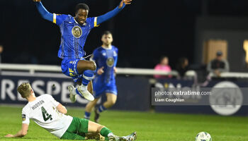 Roland Idowu jumps over a Jack Hudson challenge