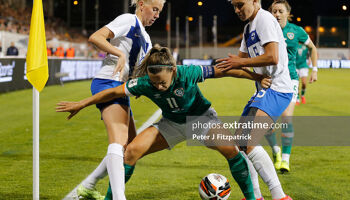 Captain Katie McCabe holding off the Finnish defenders  late on in Thursday's game in Tallaght