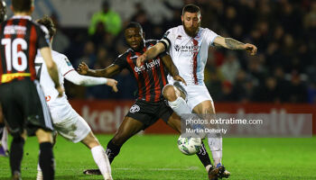 Oluwaseun Akintunde is challenged by Gary Deegan during Bohemians Premier Division encounter against Drogheda United at Dalymount Park on Monday, 6 March 2023.