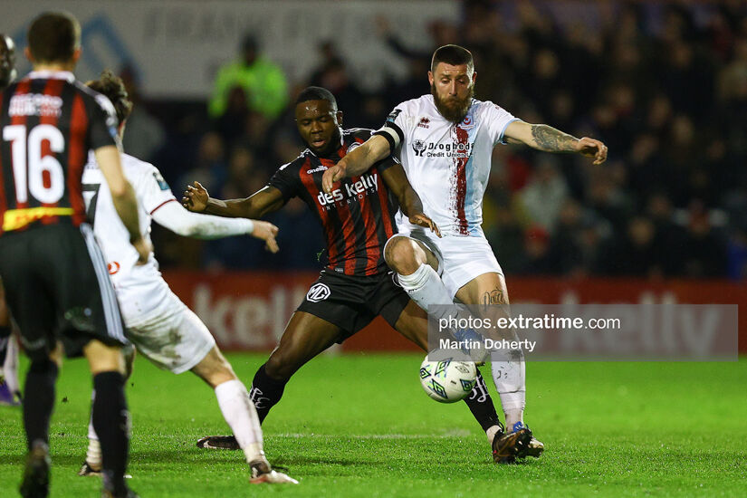 Oluwaseun Akintunde is challenged by Gary Deegan during Bohemians Premier Division encounter against Drogheda United at Dalymount Park on Monday, 6 March 2023.