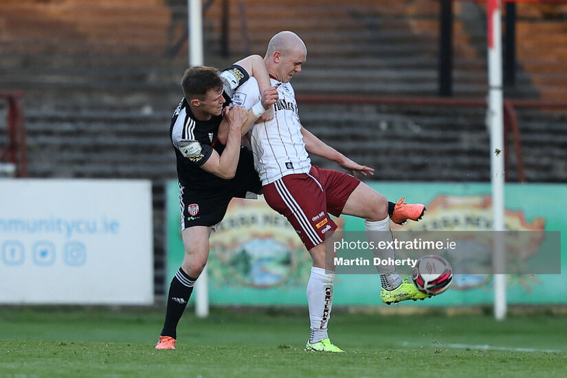 Cameron McJannett of Derry City tussles with Bohemians' Georgie Kelly during the Candystripes' 2-1 win at Dalymount Park on April 30, 2021.