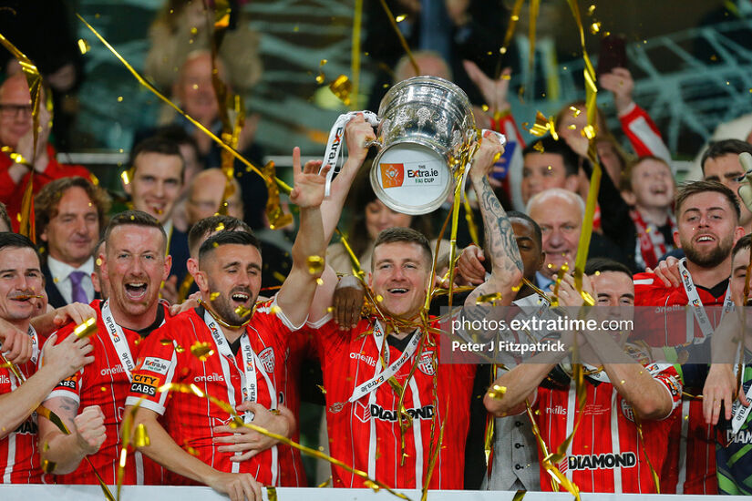 The McEleney brothers Shane (second left) and Patrick (holding cup) celebrate winning the FAI Cup with Derry City