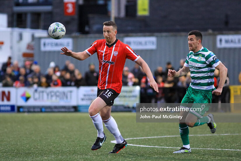 Shane McEleney on the ball ahead of Aaron Greene's during Derry's 2-0 home defeat to the Hoops in May 2023