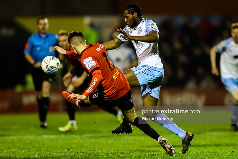 Dan Carr of Shelbourne FC tackled by Grant Horton of Bohemian FC