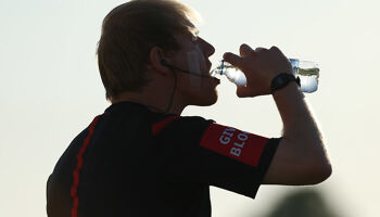 A match official takes a drink of water during the water break in the SSE Airtricity League Premier Division game between Dundalk and Cork City  on Friday 29th June 2018