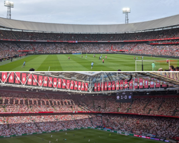 Feyenoord's home stadium De Kuip (above) and the Johan Cruyff Arena - home venue of Ajax - (below)