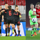 Lea Schueller of FC Bayern München celebrates with teammates after scoring and Katie McCabe (right)